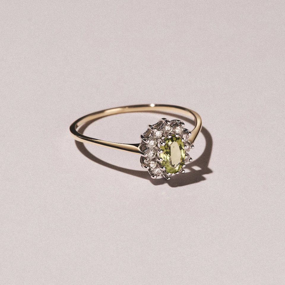 Peridot 5 x 3mm And Diamond 9K Yellow Gold Ring