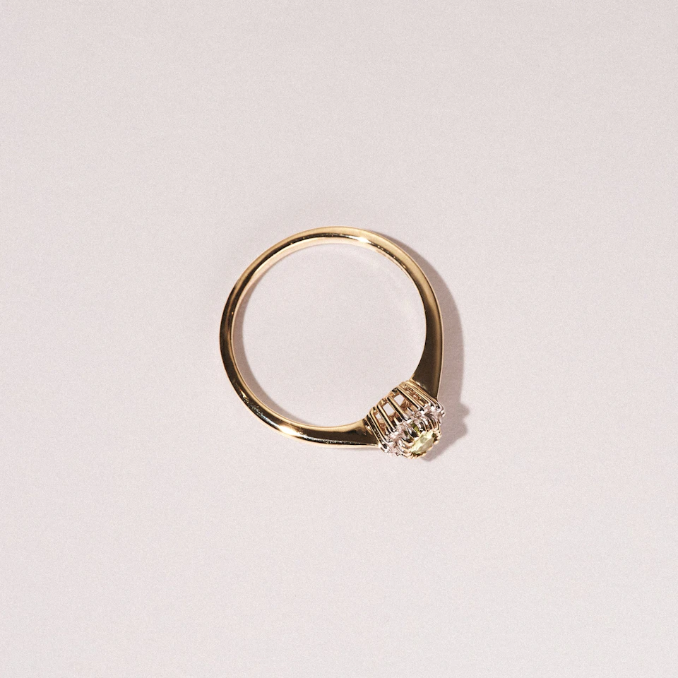 Peridot 7 x 5mm And Diamond 9K Yellow Gold Ring