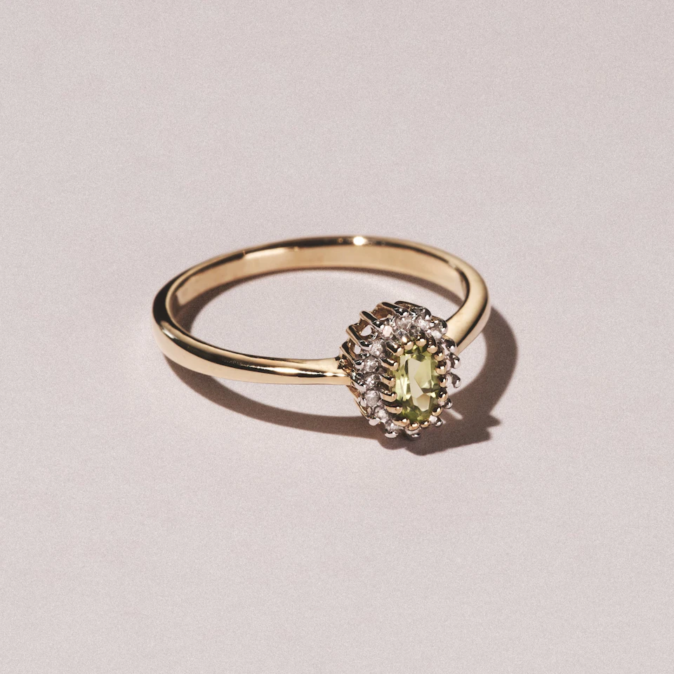 Peridot 7 x 5mm And Diamond 9K Yellow Gold Ring