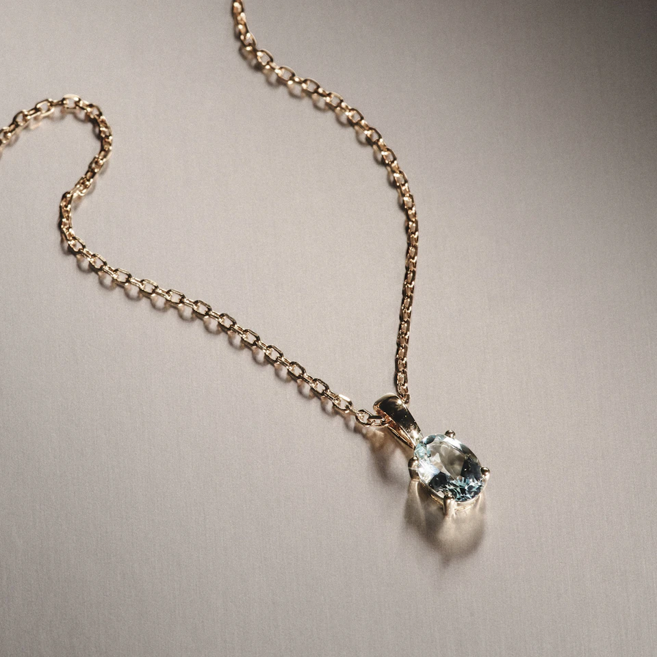 Blue Topaz 7 x 5mm 9K Yellow Gold Pendant Necklace