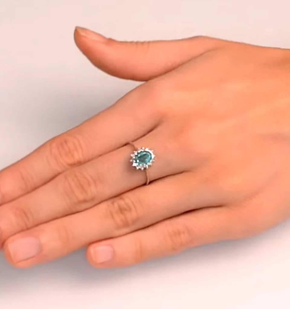 Emerald 0.83ct And Diamond 9K White Gold Ring